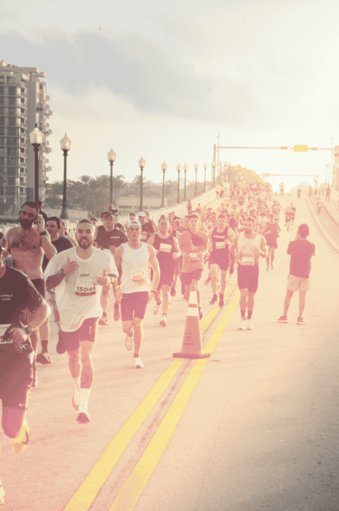 A photo of a group of people running the Miami marathon